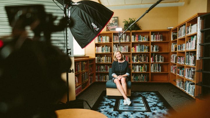 Behind the Scenes photo of a white women therapist making a professional video